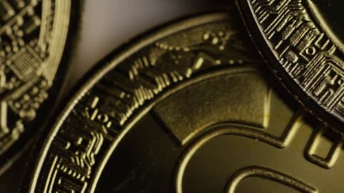 Rotating shot of Bitcoins (digital cryptocurrency)