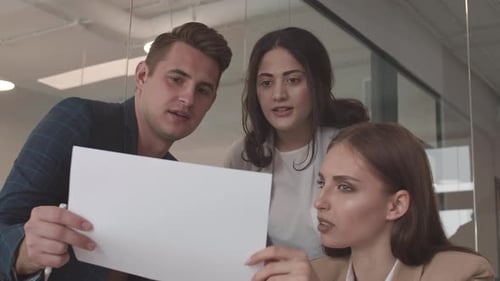 Team Collaborating on Project in Modern Office