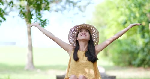 Woman open hand and take a deep breath in the park