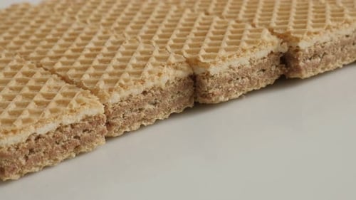 Close-up sweet thin waffle biscuit pattern 4K 21560p 30fps UltraHD slow pan footage - Israeli type