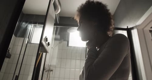 Black Female Checking and Gargling Throat