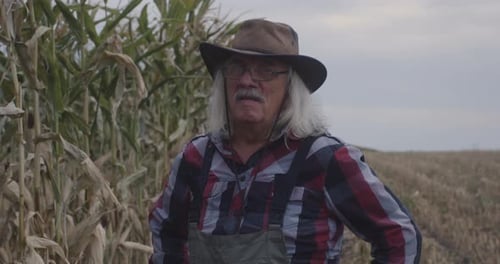 Confident Elderly Farmer in Field