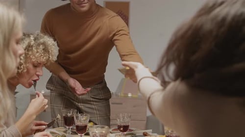 Friends and Family Enjoying Meal at Home
