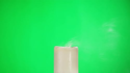 Burning Wax Candle on Green Chroma Key Background