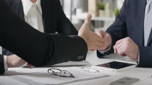 Business Meeting, Handshake Agreement in Bright Modern Office