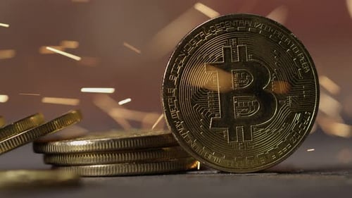 Cryptocurrency on the block chain - close up of bitcoin altcoin physical coins in dynamic setting