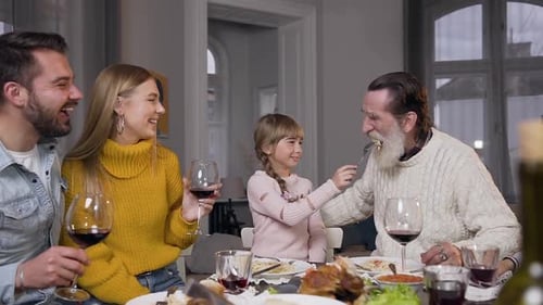 Family Enjoys Meal Together At Home