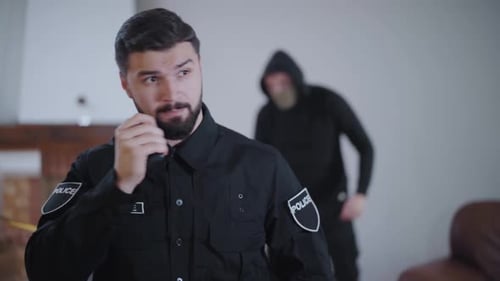 Police Officer Communicates Amidst Crime Scene