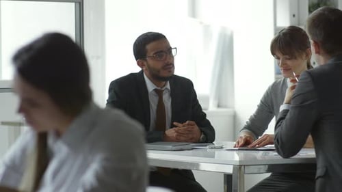 Professional Architects Discussing Project in Office