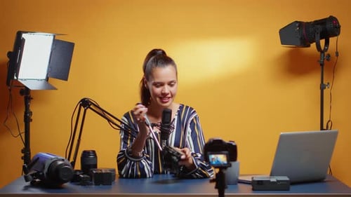 Woman Speaking into Microphone for Video Recording