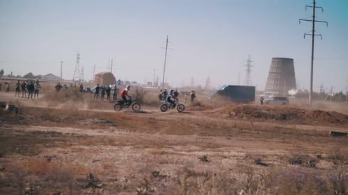 Dirt Bikes Racing on a Track in the Daytime
