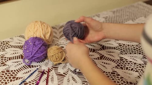 Woman Preparing Yarn for Crochet Project at Home
