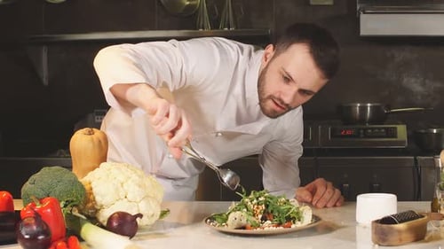 Chef Prepares Colorful Salad in Kitchen
