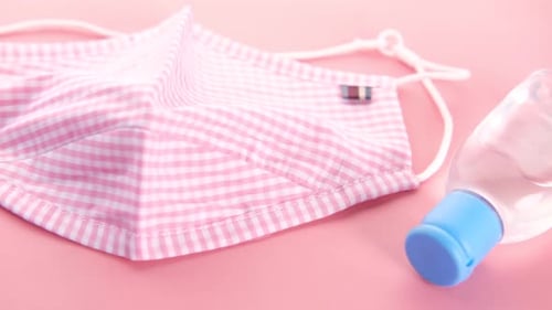 Pink Face Mask, Sanitizer, and Gloves on Pink