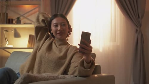 Woman Video Chatting on Smartphone in Living Room