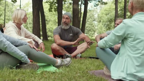 Adults Gather for Fitness Class in Park