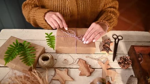 Gift Wrapping With Fern on Christmas Table