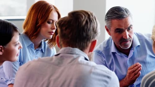 Team Discussion in a Bright Workplace Setting