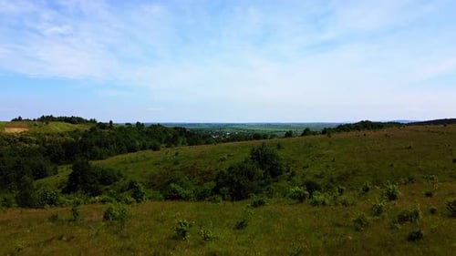 Aerial drone view of a flying over the rural agricultural landscape.
