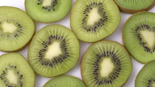 Kiwi Slices Closeup, Macro Food Summer Background, Fruits Top View. Rotate