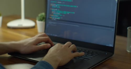 Close Up Hands Engineers Developing Software App Using Digital Laptop Computer Typing Code on Screen