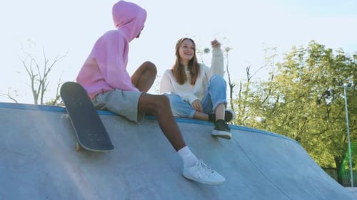 Young Adults Chatting at the Skate Park
