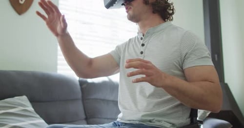 Young Adult Wearing VR Headset in Wheelchair