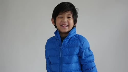 Happy Child Smiles in Winter Coat