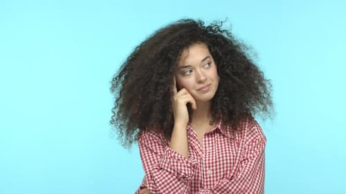 Slow Motion of Attractive European Woman with Dark Curly Hair Thinking and Looking Around Pitching