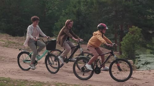 Family Cycling In Park