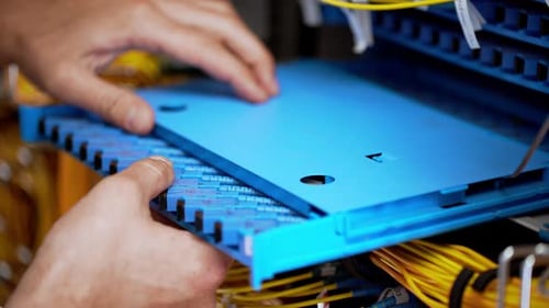 Close Up View of Hands on Splice Cassete