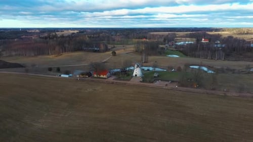 Old Araisi Windmill in Latvia Aerial Shot From Above. Winter Day at Sunrise 4K Video