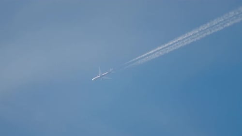 Commercial Aircraft Flying High in the Sky