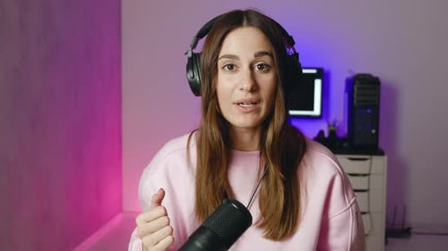 Woman in Headphones with Mic Broadcasting