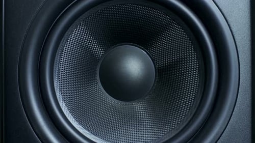 Close Up of Pumping Black Speaker Cone