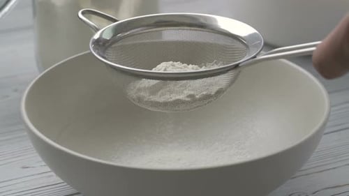 Flour Sifting into Bowl for Baking