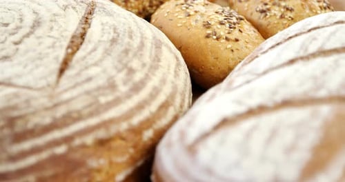 Artisan Bread Display with Seeds and Wheat Grains