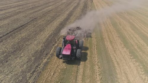 Aerial view of tractor plowing a field