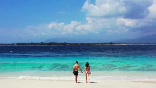 Man and woman suntan on paradise coastline beach time by blue sea with white sand background of Lomb