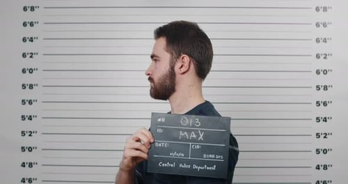 Young Adult Man Mugshot with Police Department Sign