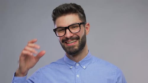 Man Smiling with Glasses in Studio