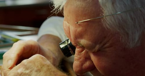 Close-up of horologist repairing a watch
