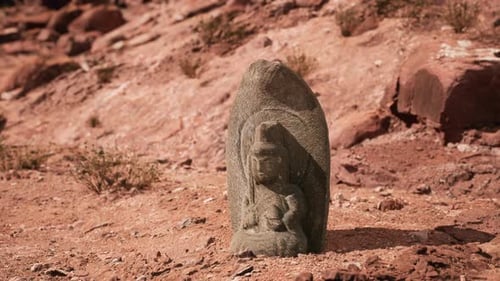 Ancient Statue on the Rocks Desert