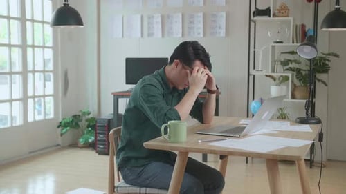 Upset Young Creative Designer Works On A Storyboard, Looks At His Sketches And Throw Papers