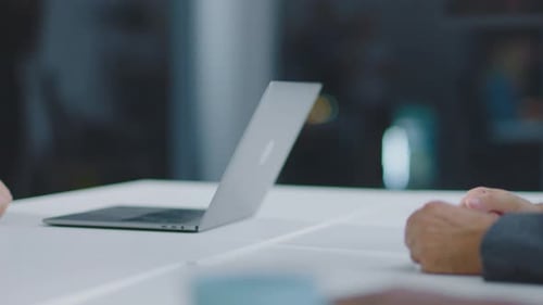 Handshake Between Two Colleagues in Modern Office