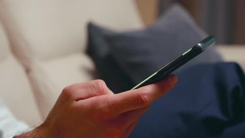 Close Up of Businessman Browsing on Smartphone