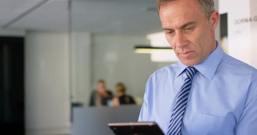 Executive using digital tablet in office 4k