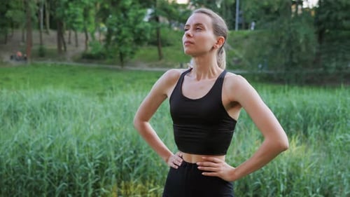 Woman Resting and Catching Breath After Workout