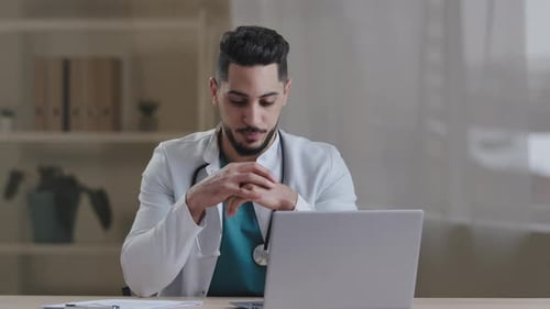 Doctor in Office Talking Via Video Call