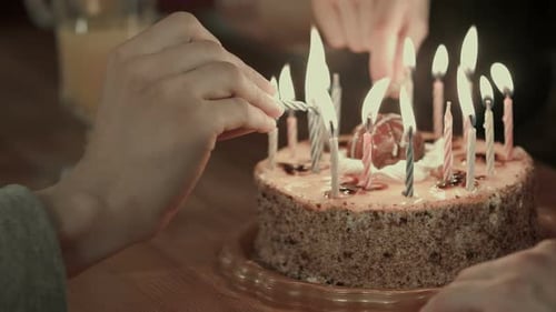 Lighting Birthday Candles on Cake at Home